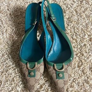 Vintage Gucci kitten heels in monogram with teal trim and new heel tips. Size 9